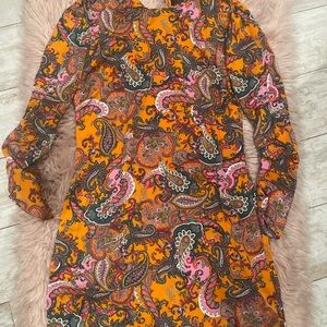 Beautiful multicolored dress that zips. Only worn once.